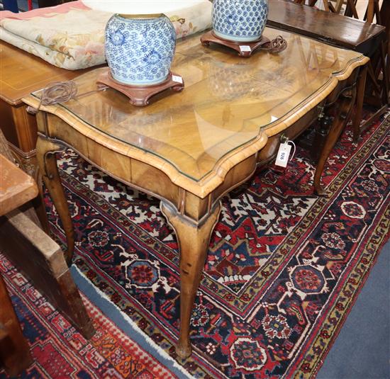 A George I style banded walnut writing table, on cabriole legs W.120cm